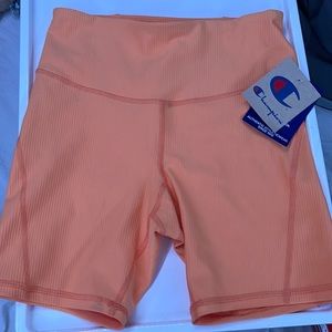 Orange Champion biker shorts. Size small